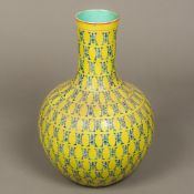 A Chinese porcelain baluster vase With allover blue decoration on a yellow ground,