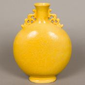 A Chinese yellow ground porcelain moon flask Of typical form, with pierced handles,