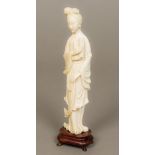 A late 19th/early 20th century Chinese carved ivory figure of Guanyin Typically worked. 23 cm high.