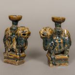 A pair of Chinese Ming Dynasty pottery incense holders Modelled as temple lions. 18 cm high.