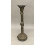 A 19th century Persian pierced brass ebonised wooden mounted stand Of segmented form,
