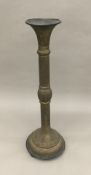 A 19th century Persian pierced brass ebonised wooden mounted stand Of segmented form,