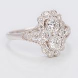 An Art Deco style 18 ct white gold diamond ring Centrally set with two 0.