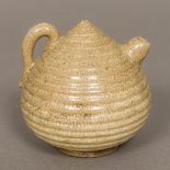 A Chinese "Five Kingdoms" pottery water dropper Of ribbed beehive form. 8.5 cm high.