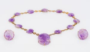 A Chinese unmarked yellow metal mounted carved amethyst necklace Together with a pair of clip-on