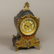 A 19th century Boulle mantel clock The shaped top surmounted with a floral cresting,