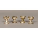 A set of four silver plated novelty golfing egg cups 4.5 cm high.