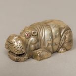 A novelty silver animalier model Formed as a hippopotamus with inset ruby cabochon eyes,