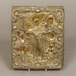 An 18th/19th century Russian gilt metal clad painted wooden icon Depicting the Virgin Mary and