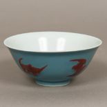A Chinese porcelain bowl Decorated with bats on a blue ground,