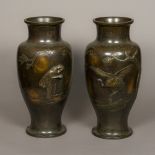 A pair of large Japanese bronze vases Each decorated with a crane, in naturalistic setting. 53.