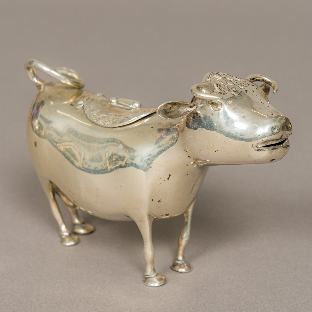 A 19th century Dutch silver Export cow creamer Typically modelled. 14 cm long.