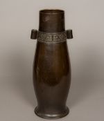 A Chinese bronze arrow vase Of slender baluster form, decorated with a archaistic band. 47 cm high.