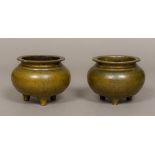 A pair of 19th century Chinese patinated bronze censers Each of squat circular form,