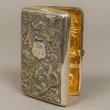 A late 19th/early 20th century Chinese silver cigarette case Embossed to the front with dragons