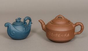 Two Chinese Yixing pottery teapots One worked as waves, the other with bamboo handle and spout,