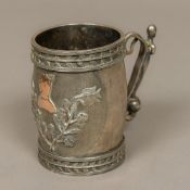 An unusual white metal tankard The top set with a twin row of leaves above the scrolling snake and