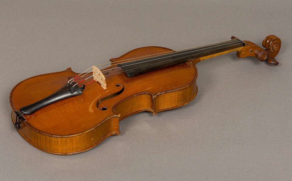 An early 20th century French 3/4 size violin A label to the interior "d'apres Antonius Stradivarius