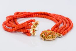 A five strand coral bead necklace Set with cabochon coral mounted pierced gold clasp. 41.