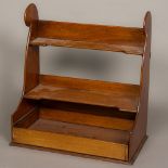 A 19th century mahogany shaped hanging shelves With fitted open drawer.