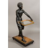 A late 19th century painted carved wooden Blackamoor Modelled as an African boy with glass inset