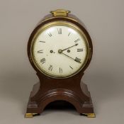 A George III mahogany cased balloon clock The white painted dial with Roman numerals and twin