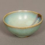 A Chinese Jin Dynasty Jun Ware pottery bowl With typical glaze. 8 cm diameter.