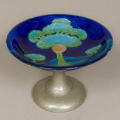 A Moorcroft Moonlit Blue pattern pottery charger The shallow dish typically decorated,