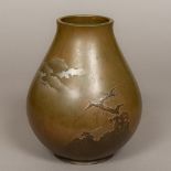 A Japanese cast bronze vase Worked with cranes in flight above treetops before Mount Fuji,