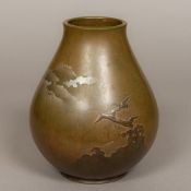 A Japanese cast bronze vase Worked with cranes in flight above treetops before Mount Fuji,