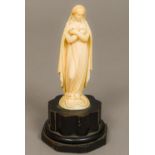 A 19th century Dieppe carved ivory figurine Modelled as the Virgin Mary with the serpent under foot,