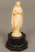 A 19th century Dieppe carved ivory figurine Modelled as the Virgin Mary with the serpent under foot,