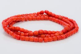 A coral bead single strand necklace Approximately 90 cm long.