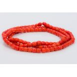 A coral bead single strand necklace Approximately 90 cm long.