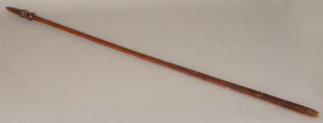 A Maori taiaha quarter staff Of typical form, with janus-head finial,