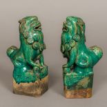 A pair of Chinese porcelain temple lions, Ching Dynasty Typically modelled with green glaze.