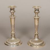 A pair of George III loaded silver candlesticks, hallmarked Sheffield 1813,