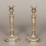A pair of George III loaded silver candlesticks, hallmarked Sheffield 1813,