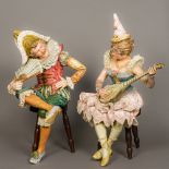 A pair of large 19th century Continental pottery figures in the Goldscheider style One formed as a