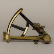 A 19th century ivory and brass mounted octant Of typical form, with multiple lenses. 33 cm high.