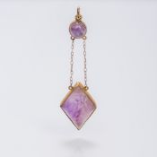 An unmarked gold framed Islamic hardstone pendant Of inverted drop form,