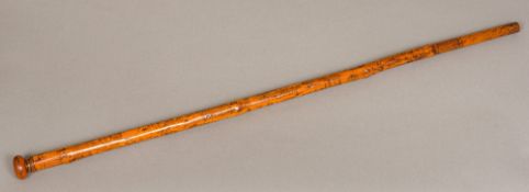 A 19th century Folk Art engraved treen walking stick Decorated in the round with figures in