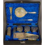 A Chinese silver mounted dressing set, hallmarked for Tuck Chang Comprising: hand mirror, shoehorn,