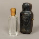A 19th century Continental gold mounted cut clear glass scent bottle Of facet cut form,