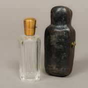 A 19th century Continental gold mounted cut clear glass scent bottle Of facet cut form,