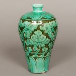 A Chinese Song porcelain chrysanthemum vase With scroll decoration on a turquoise ground.