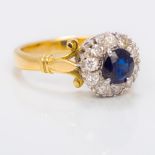 An 18 ct gold diamond and sapphire set ring The stones claw set.