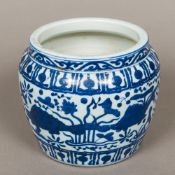 A Chinese blue and white porcelain jardiniere Worked with aquatic animals in the round. 17.