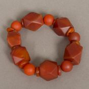 A Qing Dynasty carved agate bead bracelet The stones, round disc and facet cut. 10.
