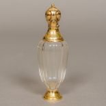 A Continental unmarked gold mounted glass scent bottle 11 cm high.